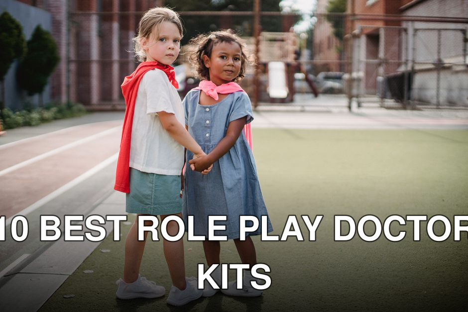 Two young girls in superhero capes playing joyfully on an outdoor playground.