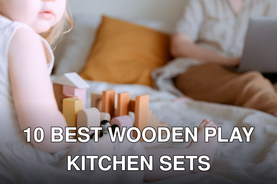 Crop faceless toddler girl in casual wear sitting on bed and playing with colorful wooden blocks while mother doing remote work with laptop on knees on background