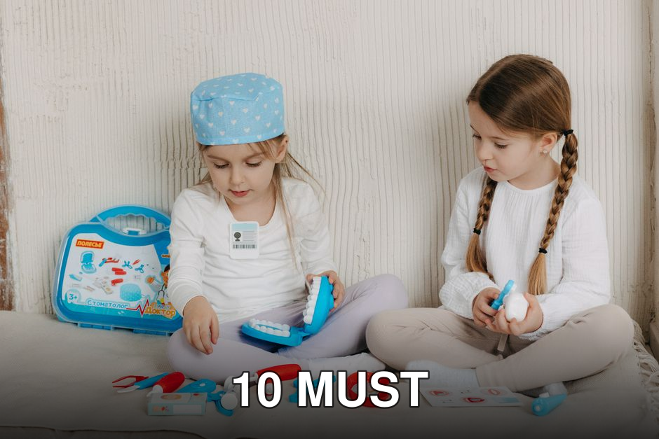Two young girls role-playing as dentists with a toy dental kit indoors.