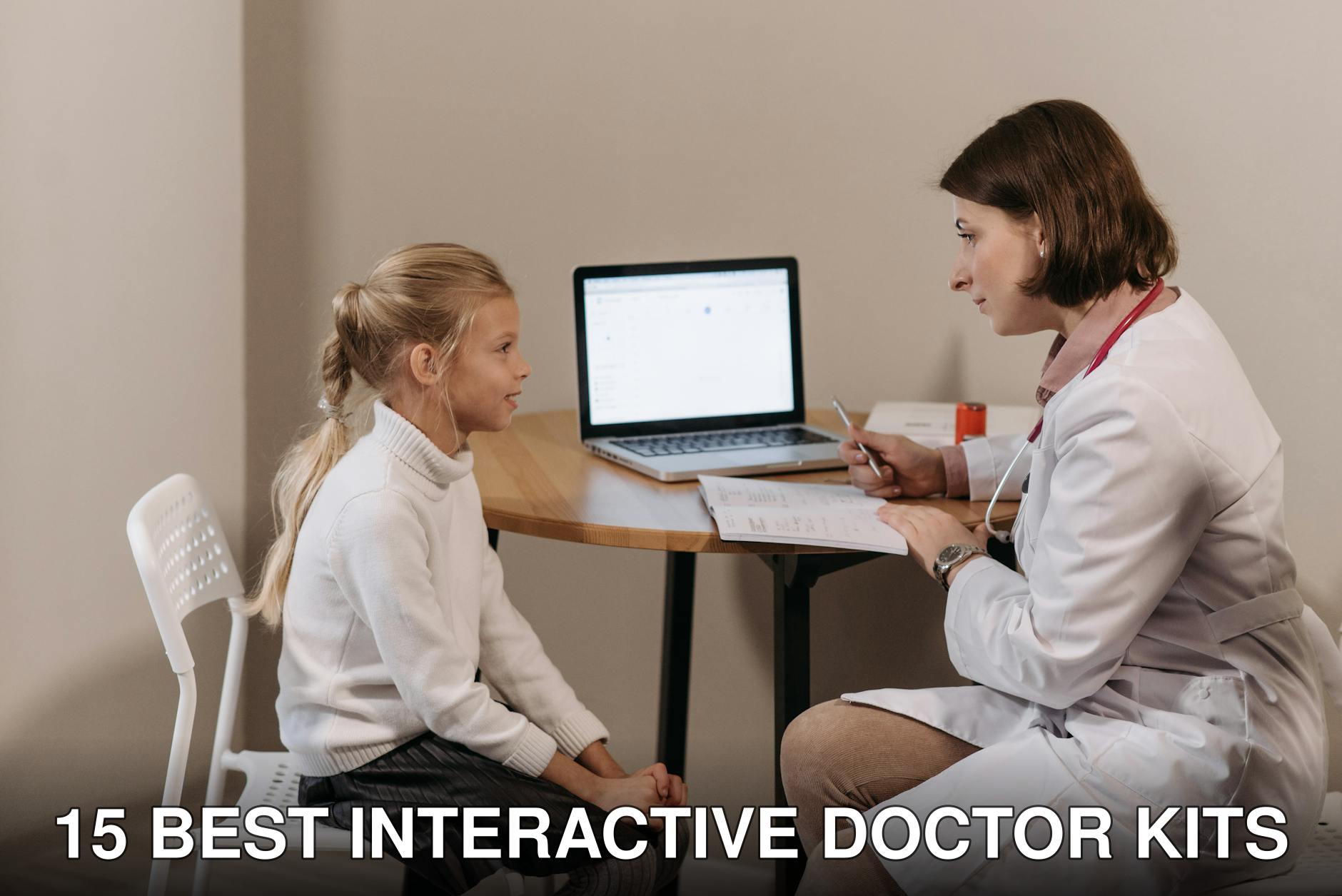Doctor in lab coat consulting a young girl in a clinic with a laptop on the table.