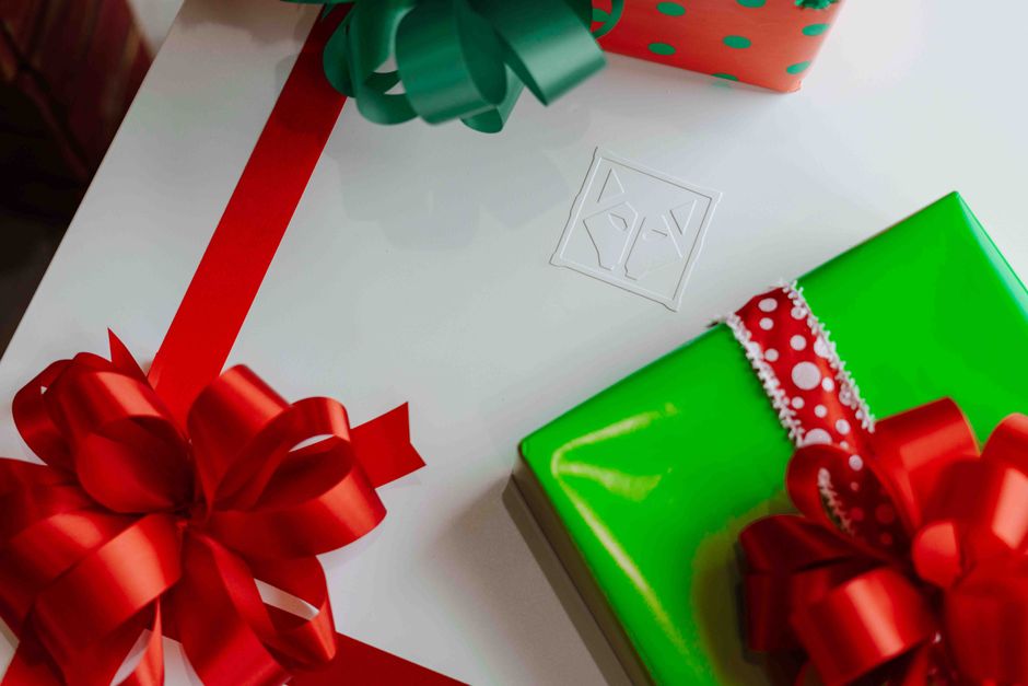 Vibrant Christmas presents with red bows perfect for festive celebrations.