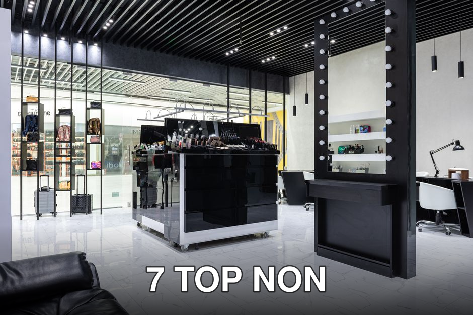 A sleek and modern salon with a central beauty product display and contemporary decor.