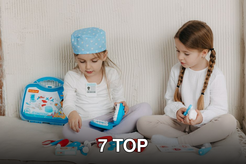 Two young girls role-playing as dentists with a toy dental kit indoors.