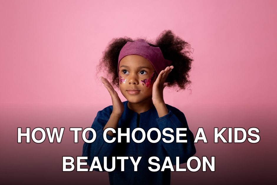 Cute child with glitter face stickers posing against a pink background in a studio.