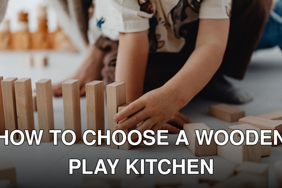 A close-up of a child arranging wooden blocks on the floor, focused on play.