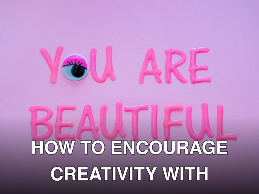 Vibrant pink artistic lettering conveys the message 'You Are Beautiful' on a soft pastel background, promoting positivity.