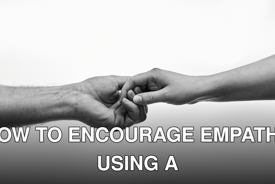Black and white photo of two hands connecting, symbolizing unity and support.
