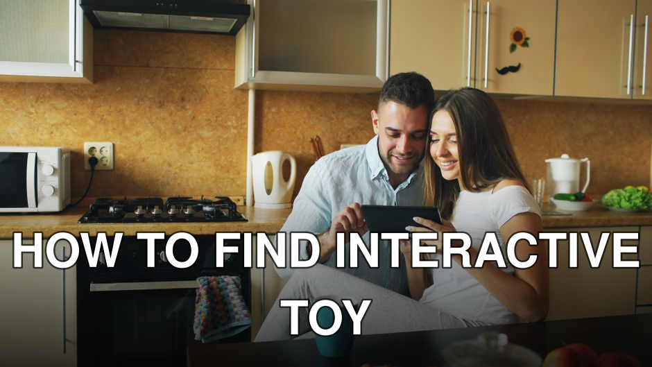 Happy couple using a tablet in a modern kitchen setting, surrounded by cozy and warm decor.
