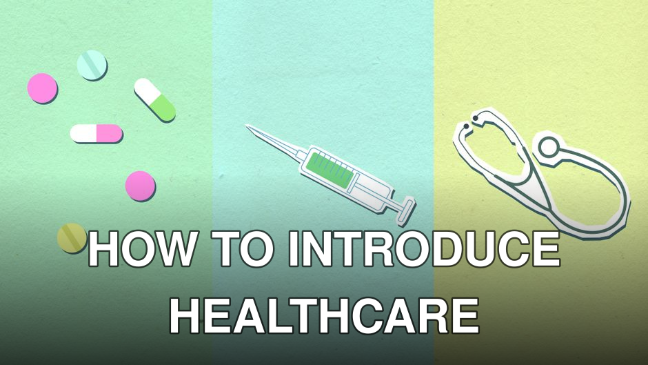 Top view of decorative cardboard appliques representing assorted medications near syringe with vaccine and stethoscope