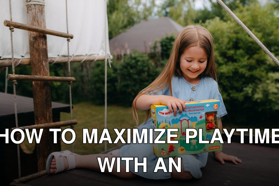 Young girl in a blue dress holding a toy box and enjoying a sunny day outdoors.