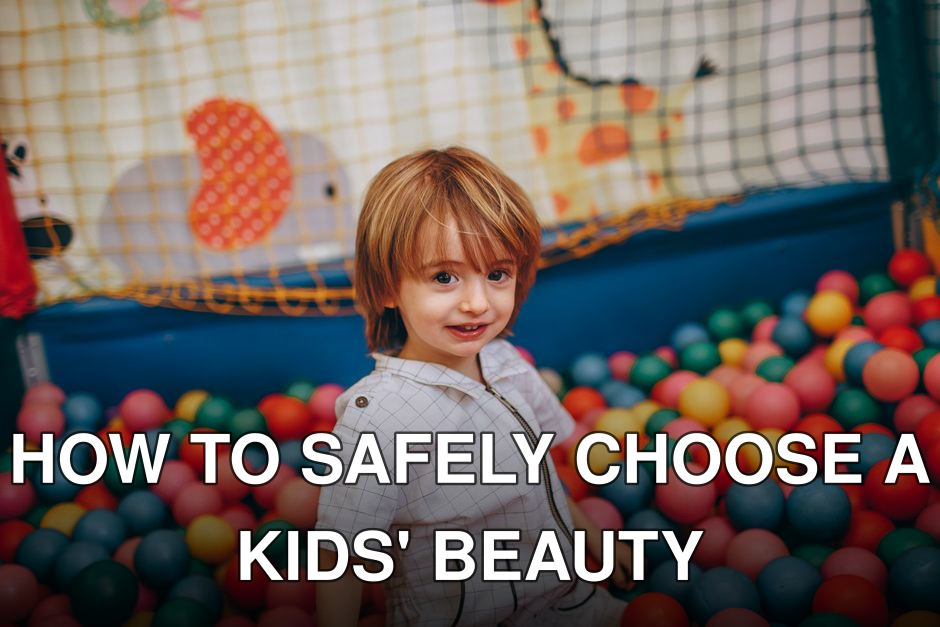 A young child enjoys playing in a colorful ball pit indoors, showcasing joy and creativity.