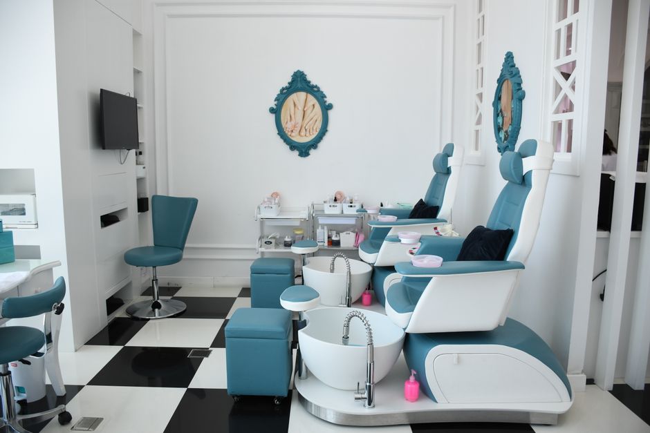 Luxurious spa interior with pedicure chairs in an upscale Abu Dhabi salon.