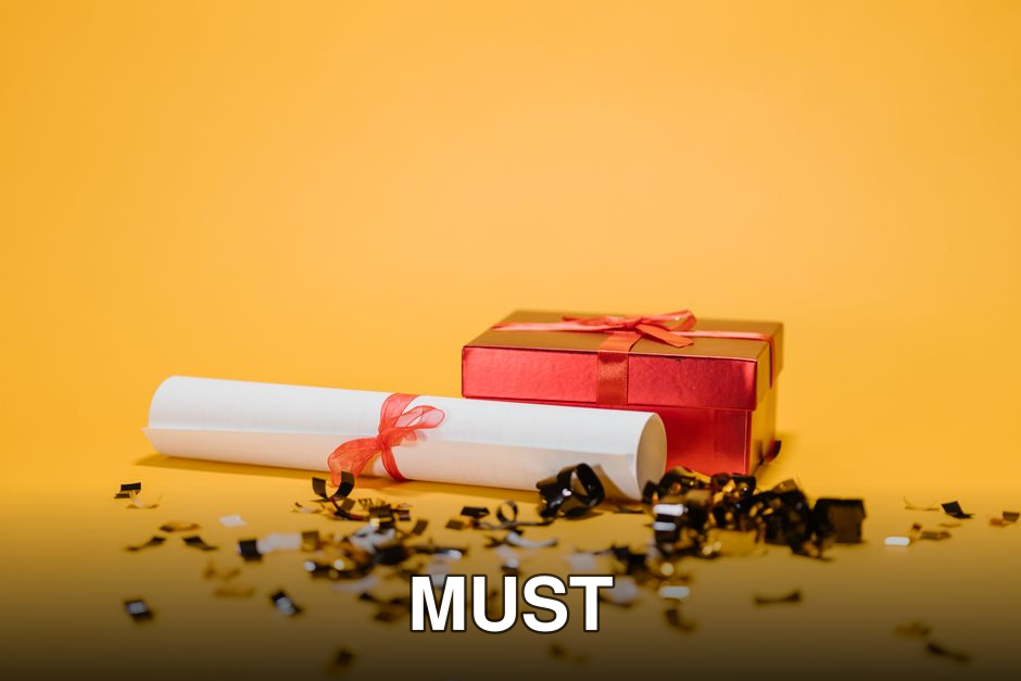Celebratory image of a diploma and gift box amidst confetti on a vibrant yellow background.