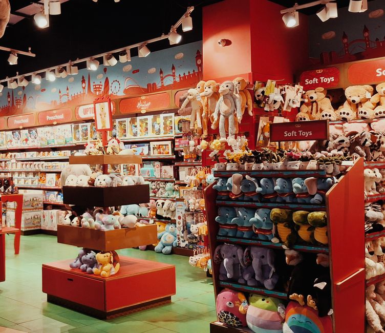 Explore a colorful toy store in Kerala, India filled with plush toys and educational games.