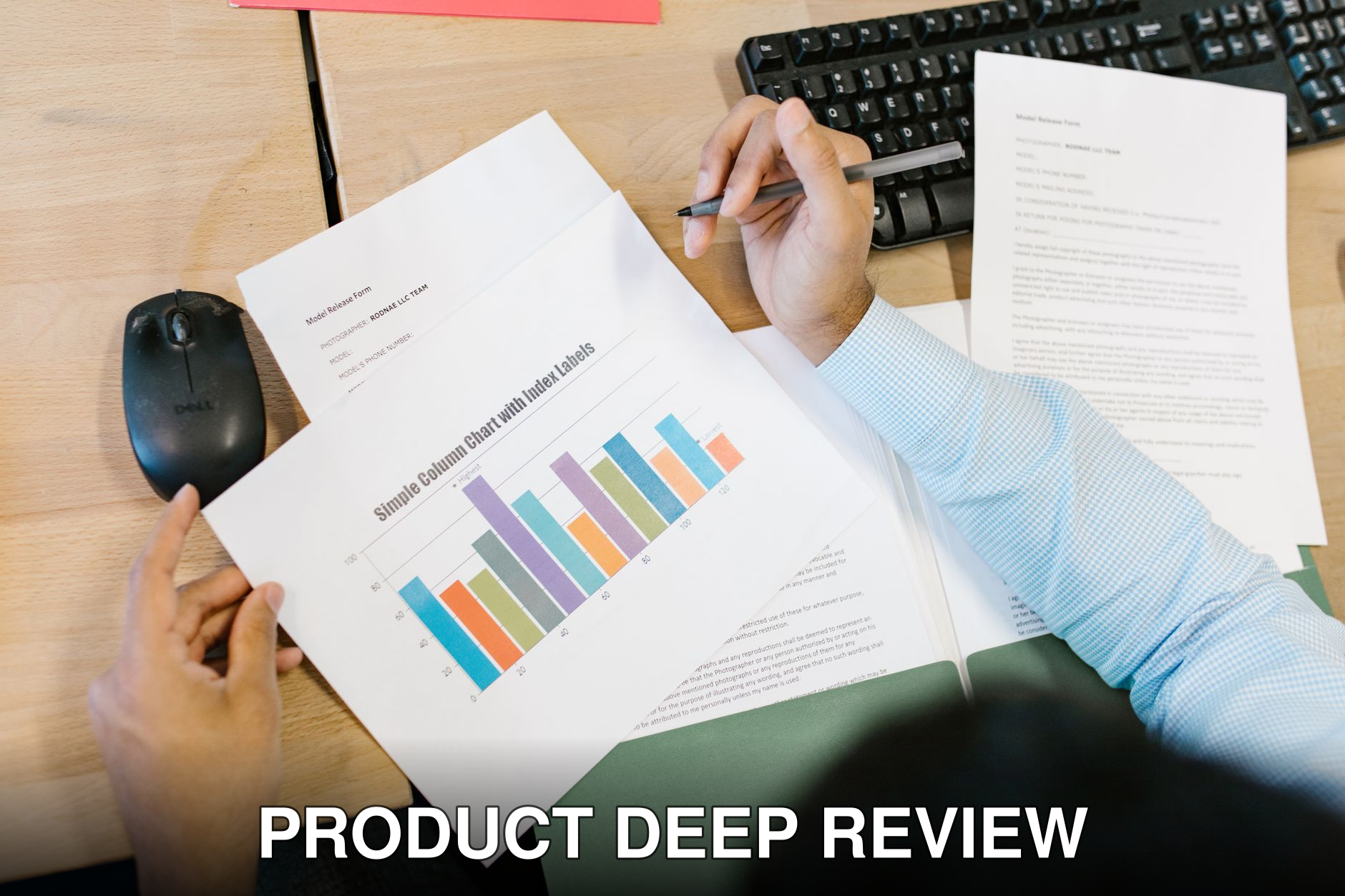 A business analyst reviews a colorful bar chart and documents at a desk, indicating data analysis.