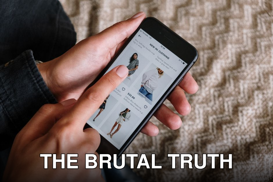 Person browsing clothing items on a smartphone, showcasing modern online shopping experience.