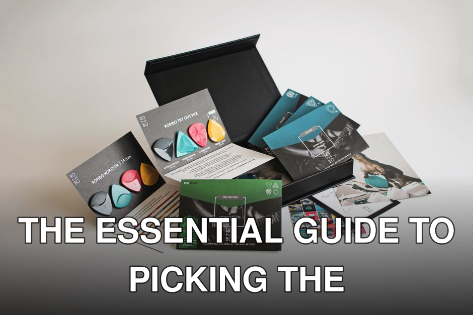 A variety pack of colorful guitar picks with packaging and promotional materials.