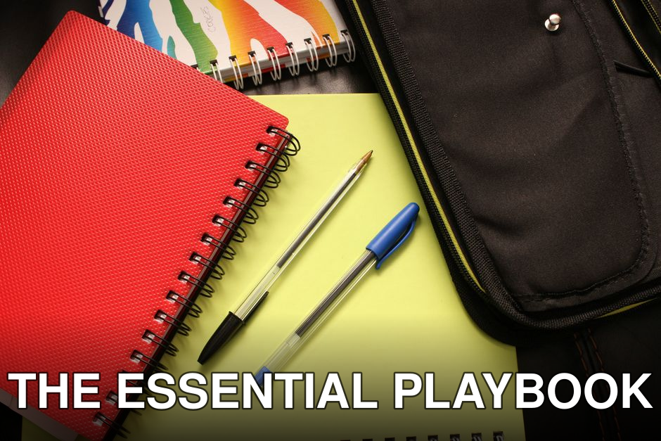 A close-up view of colorful notebooks and pens, perfect for educational themes.