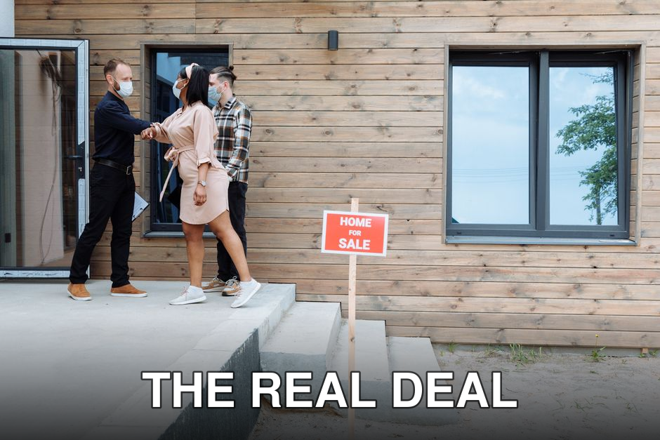 Couple meeting with real estate agent for home sale, wearing masks for safety.