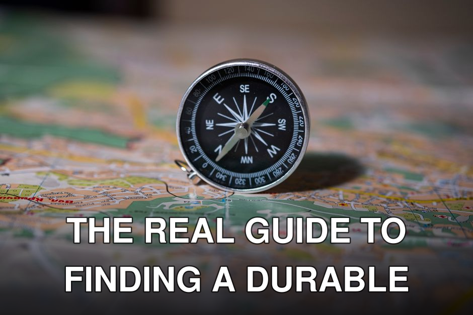 Black compass on detailed map symbolizing navigation and exploration.