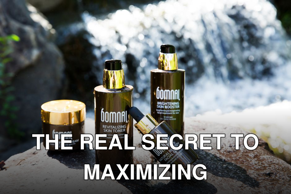 High-end skincare products showcased by a natural waterfall for a refreshing appeal.
