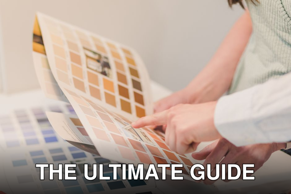 Two people discussing and choosing color palettes for interior design projects.