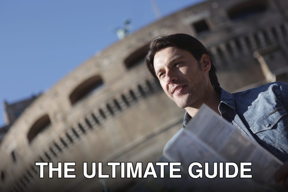 Man in denim jacket sightseeing near historical building, enjoying travel with map.