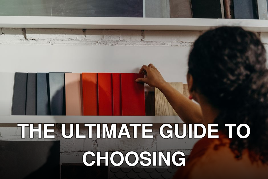 A woman chooses from an array of color samples in a design showroom.
