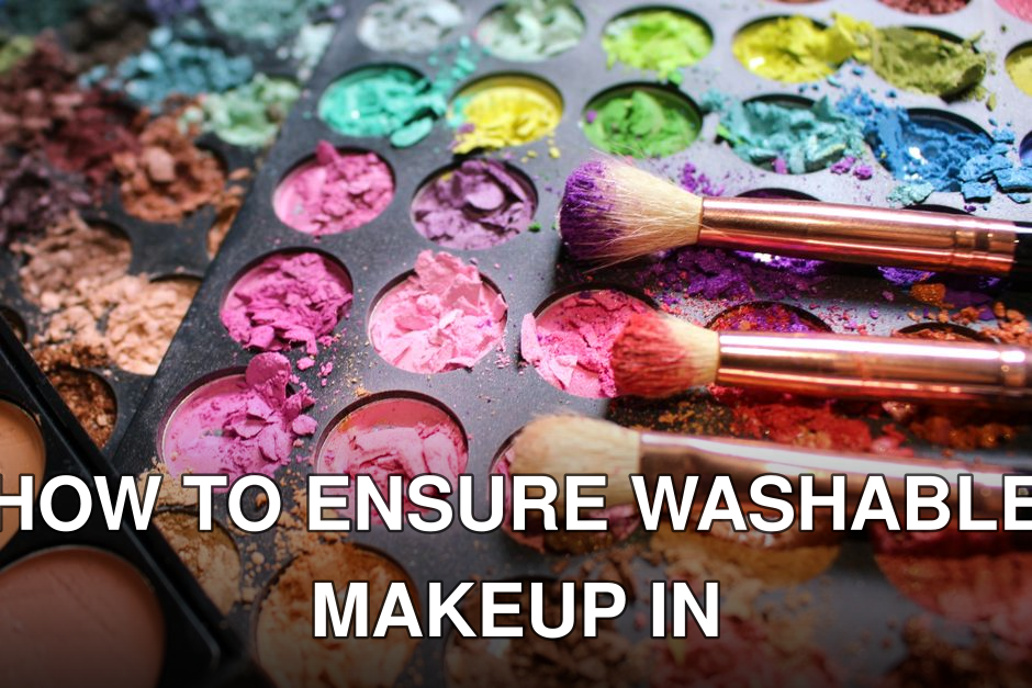 Close-up of colorful crushed makeup palette with three brushes, creating a vibrant artistic mess.