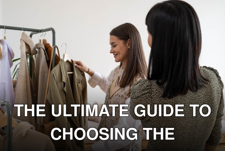 Two women selecting fashionable clothes from a rack with smiles.