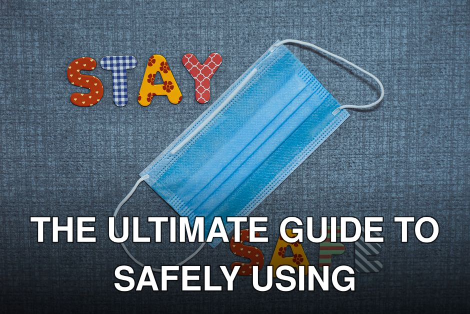 Colorful letters spelling 'Stay Safe' with a blue face mask on fabric background.